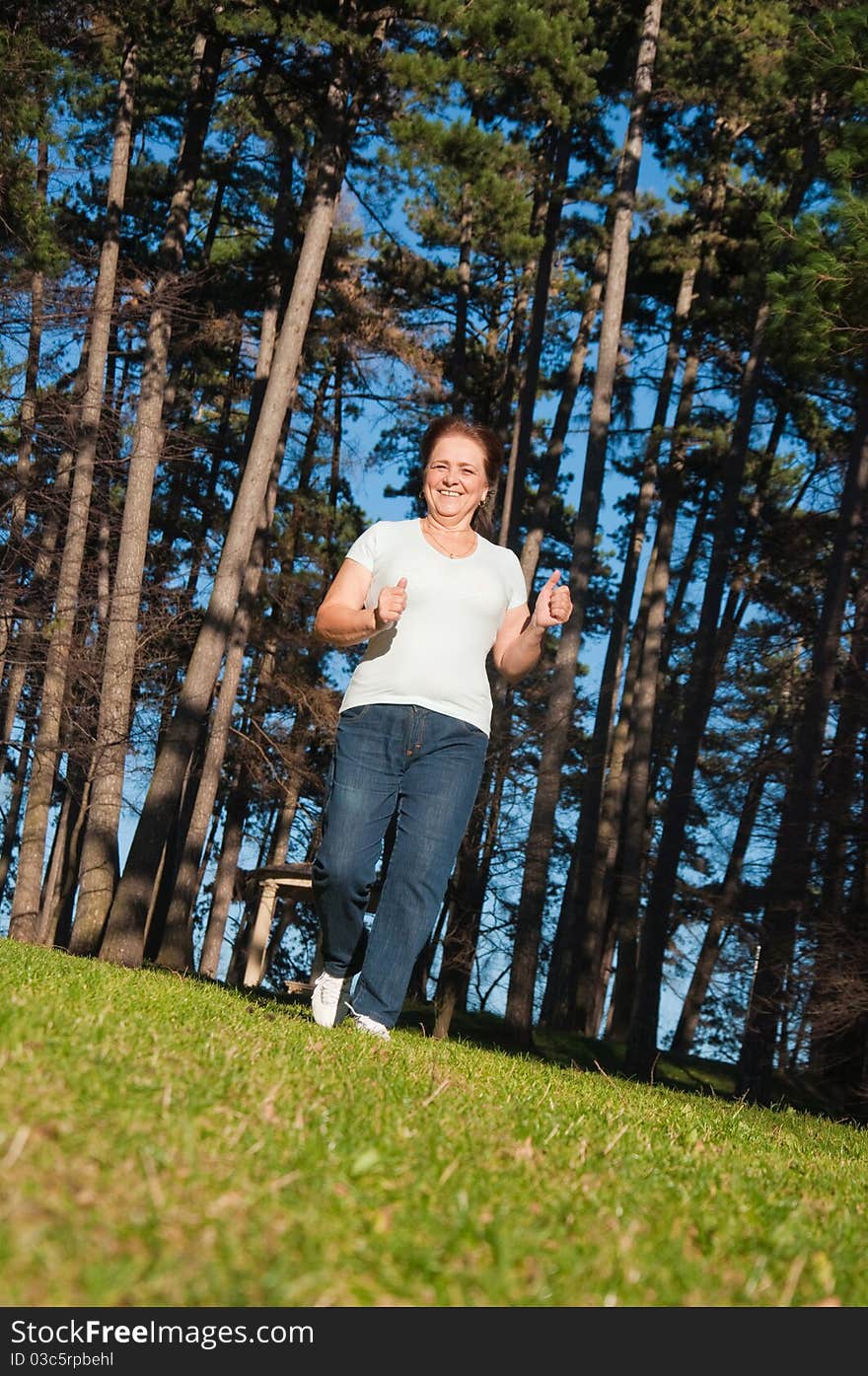 Happy elderly woman in the park. Happy elderly woman in the park