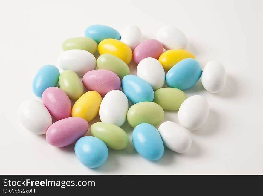 Colorful Easter almonds on white background. Colorful Easter almonds on white background