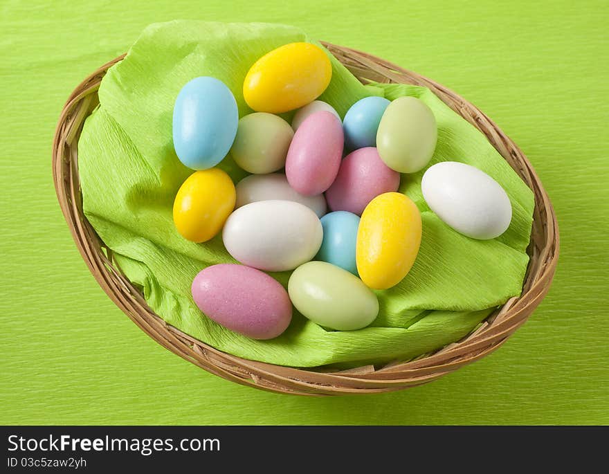 Easter, basket with almonds on white background