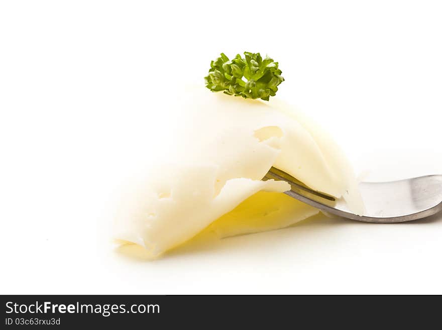 Slice Of Cheese With Parsley On Fork