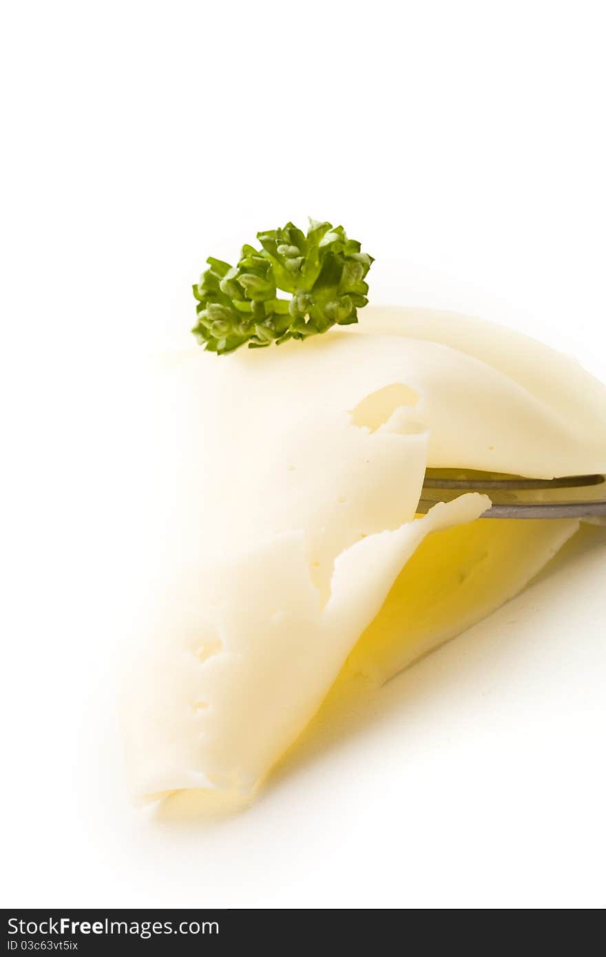 Slice Of Cheese With Parsley On Fork