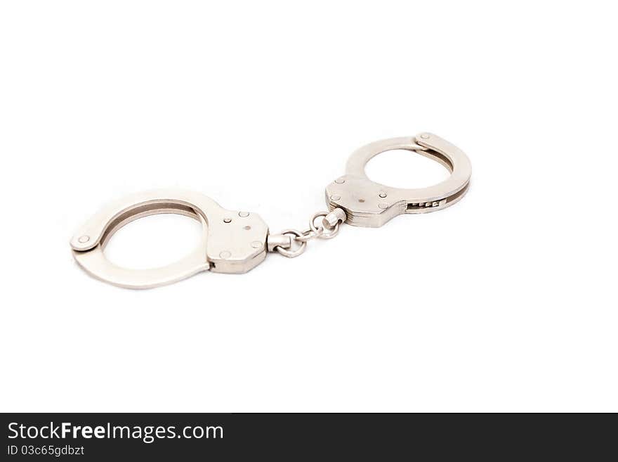 The clasped handcuffs on a white background