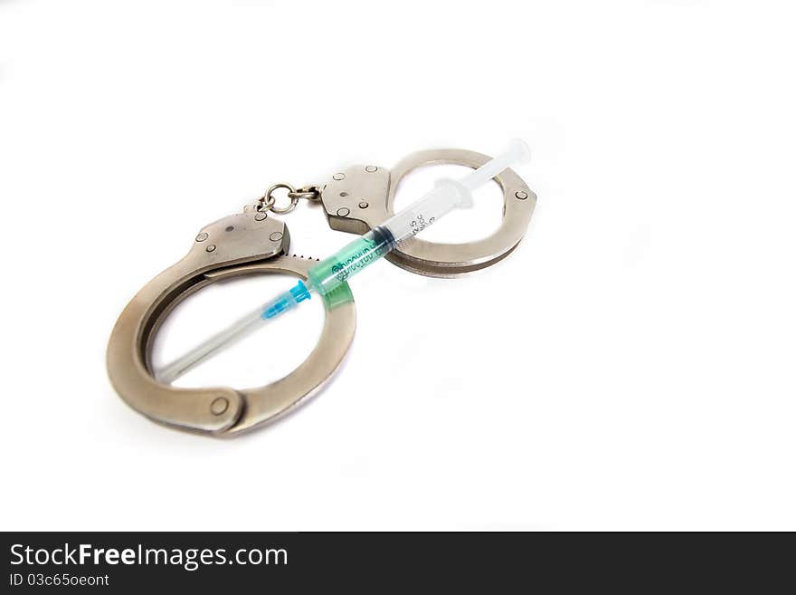 Handcuffs and syringe