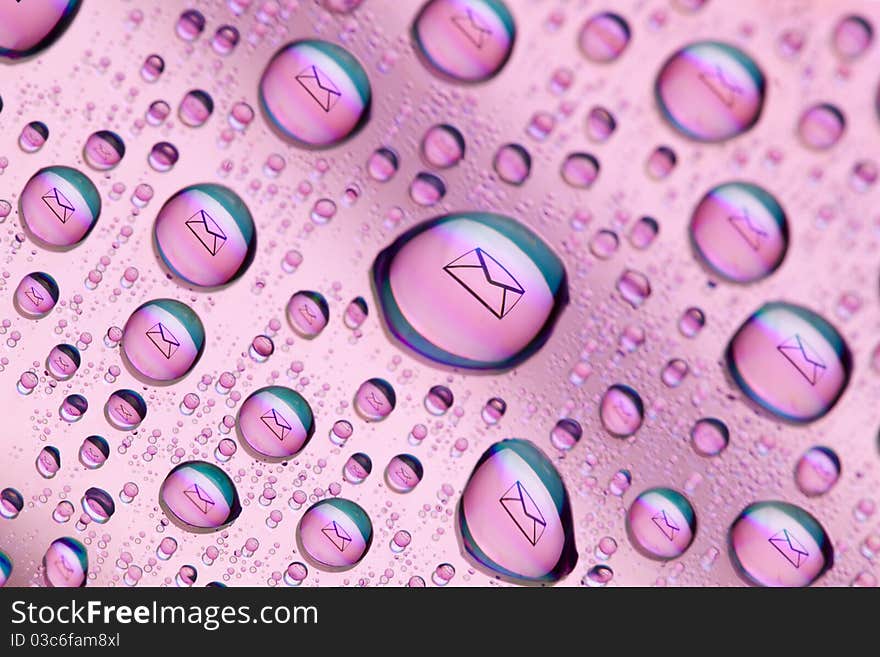 Envelope symbol reflected in the drops of water. Close-up of water droplets placed on a DVD disc. Envelope symbol reflected in the drops of water. Close-up of water droplets placed on a DVD disc.