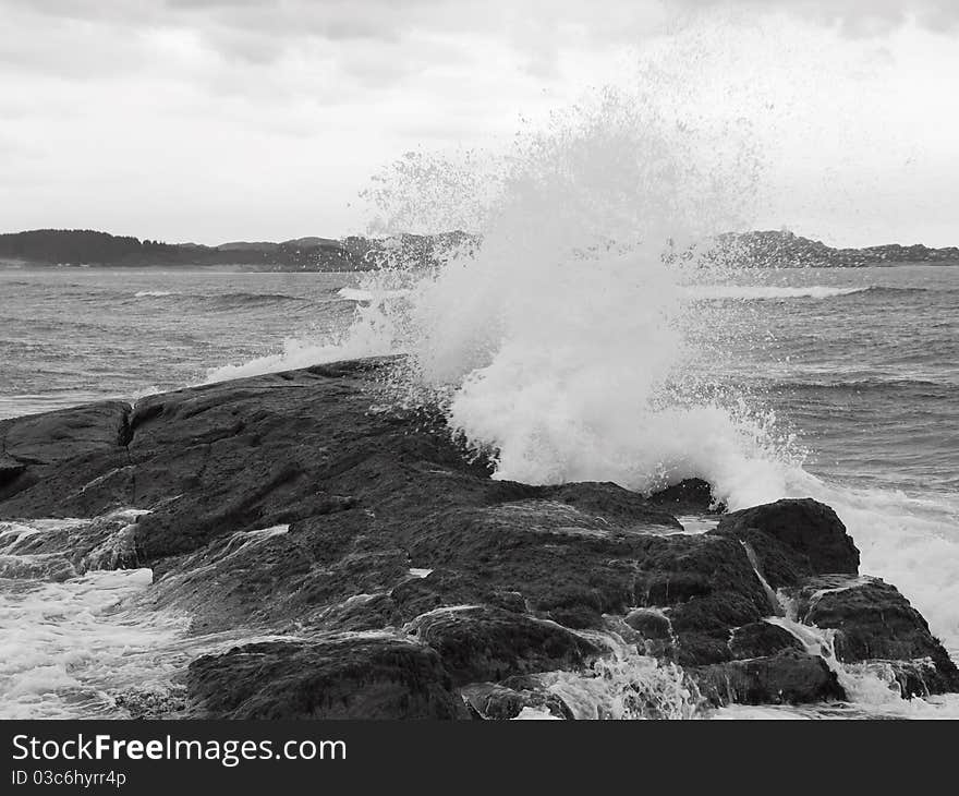 Wave breaking against coast rock