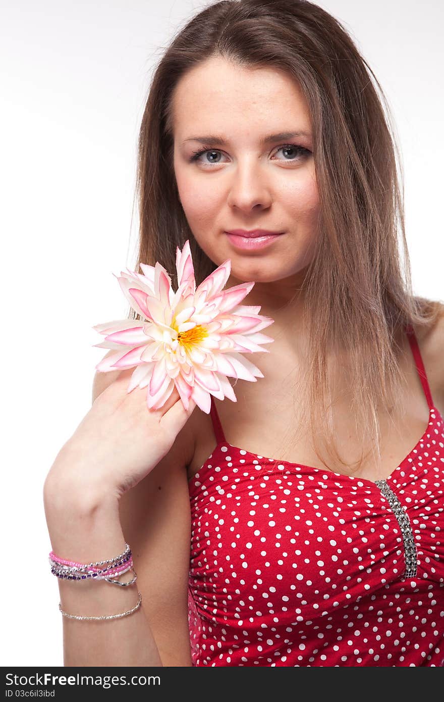 Attractive woman in red dress posing on white