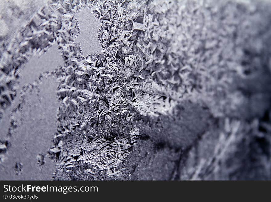 Patterns of ice on the glass window