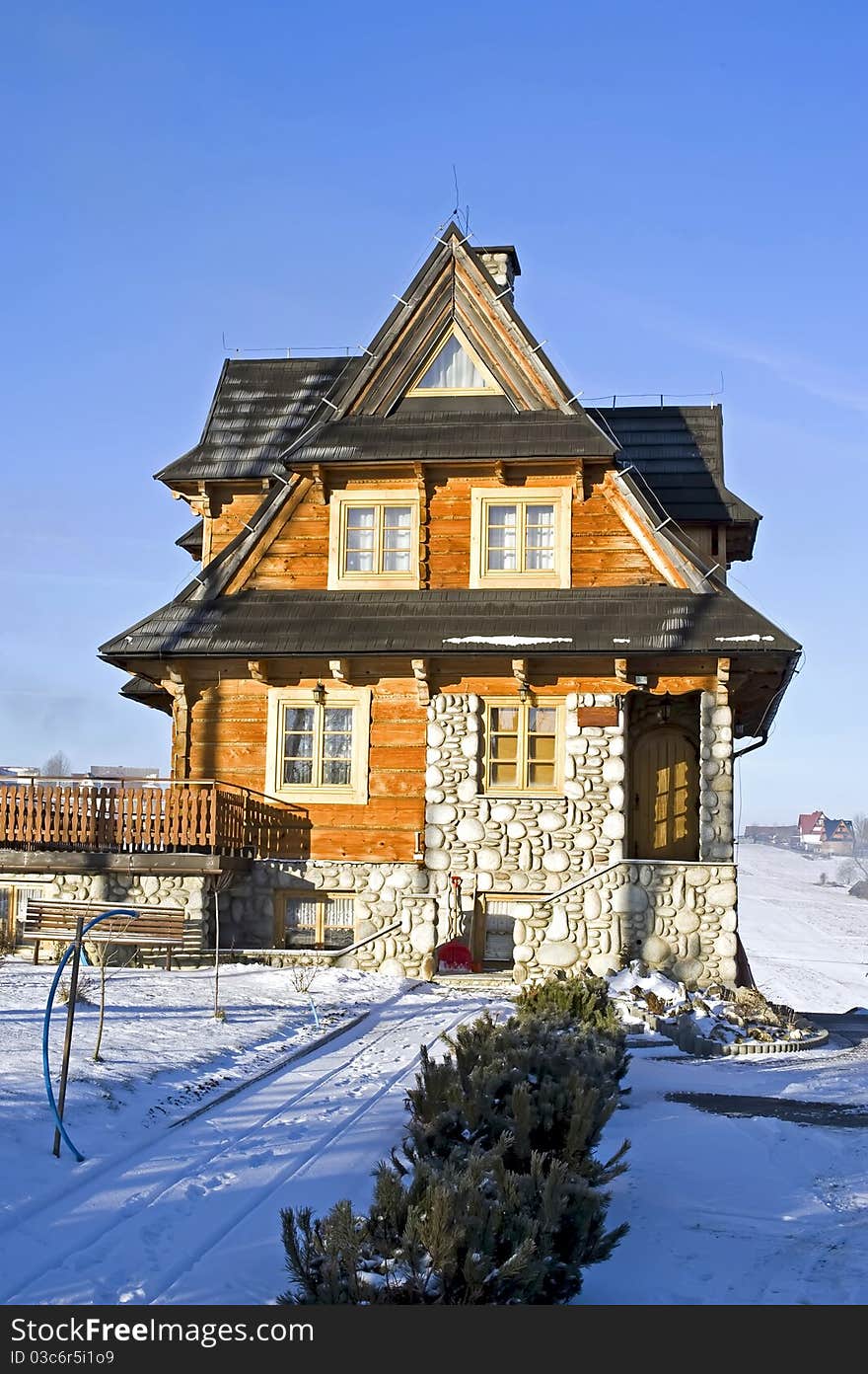 Front of the traditional house in Polish moutain in wintertime at frosty and sunny morning. Front of the traditional house in Polish moutain in wintertime at frosty and sunny morning.