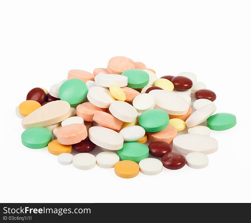 Medicines, tablets of different colors on a white background for your design