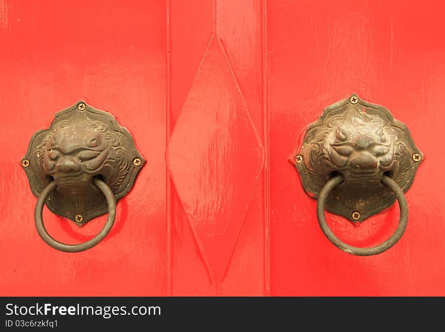 Oriental door knob on red background