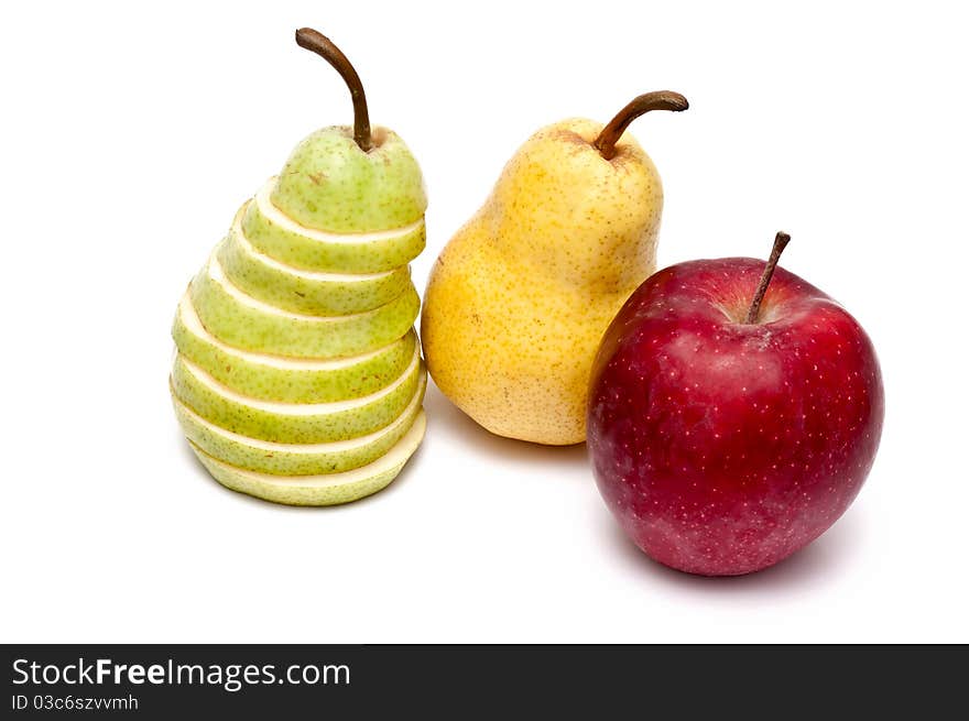 Green slliced pear, yellow pear and a red apple. Green slliced pear, yellow pear and a red apple