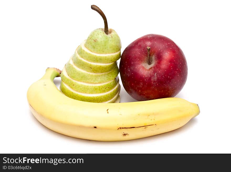 Sliced green pear, red apple and a banana. Sliced green pear, red apple and a banana