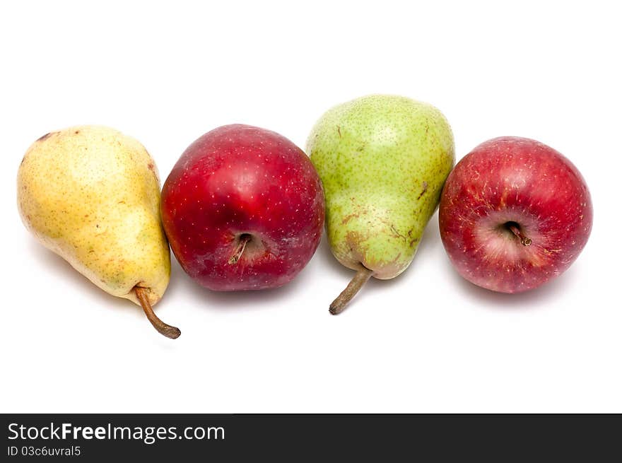 Red apples, yellow and green pears over white background