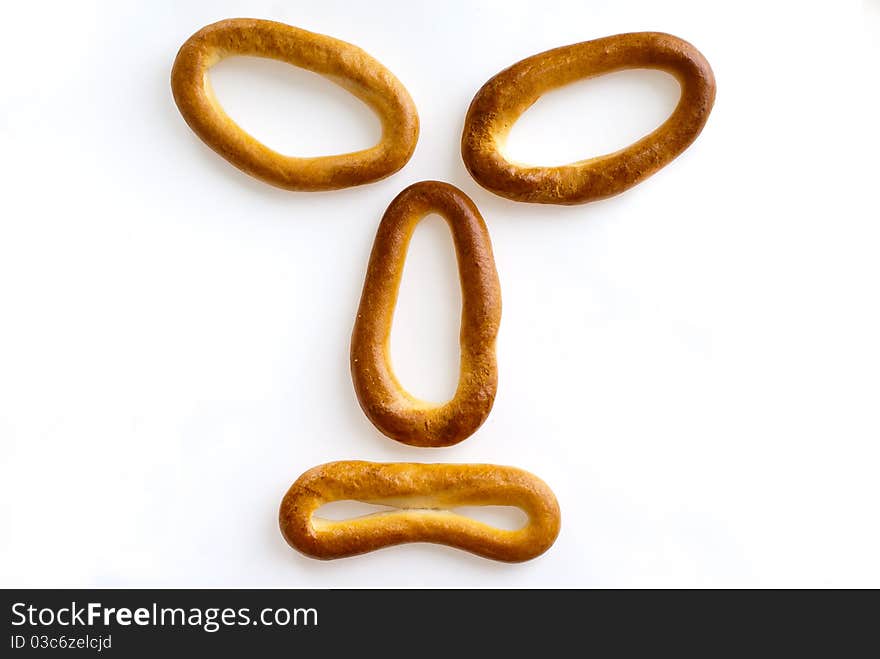 Meal theme. Nice bagels on a white background, look like appetizing. Meal theme. Nice bagels on a white background, look like appetizing.