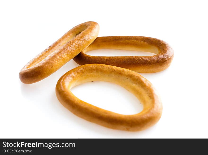 Meal theme. Nice bagels on a white background, look like appetizing. Meal theme. Nice bagels on a white background, look like appetizing.