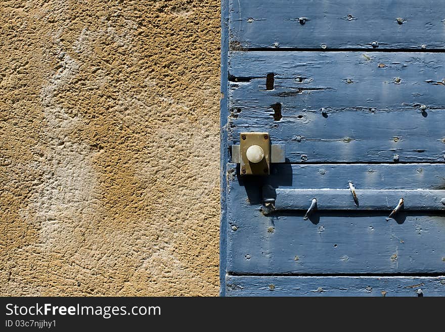 Blue door shutter with old paint,