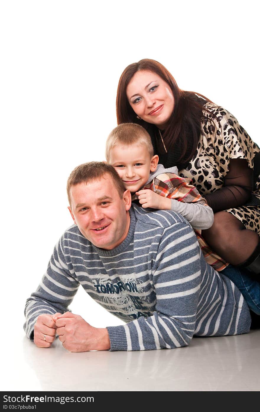 Portrait of a young happy smiling family isolated on white