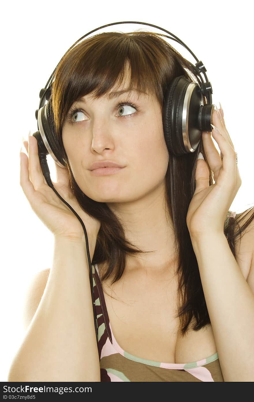 Woman listening to music. Lots of copyspace and room for text on this isolate