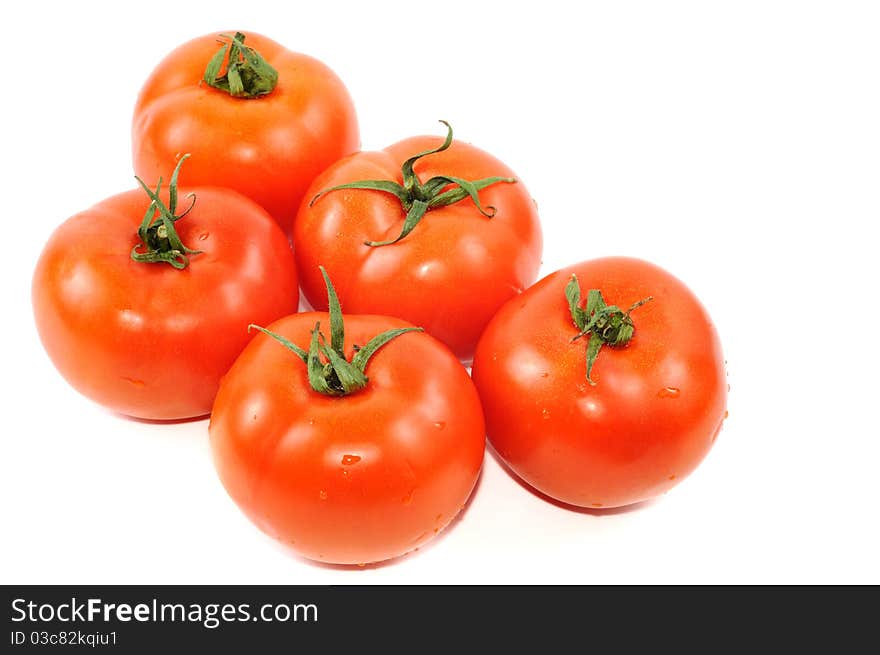 Five red tomato isolated on a white background