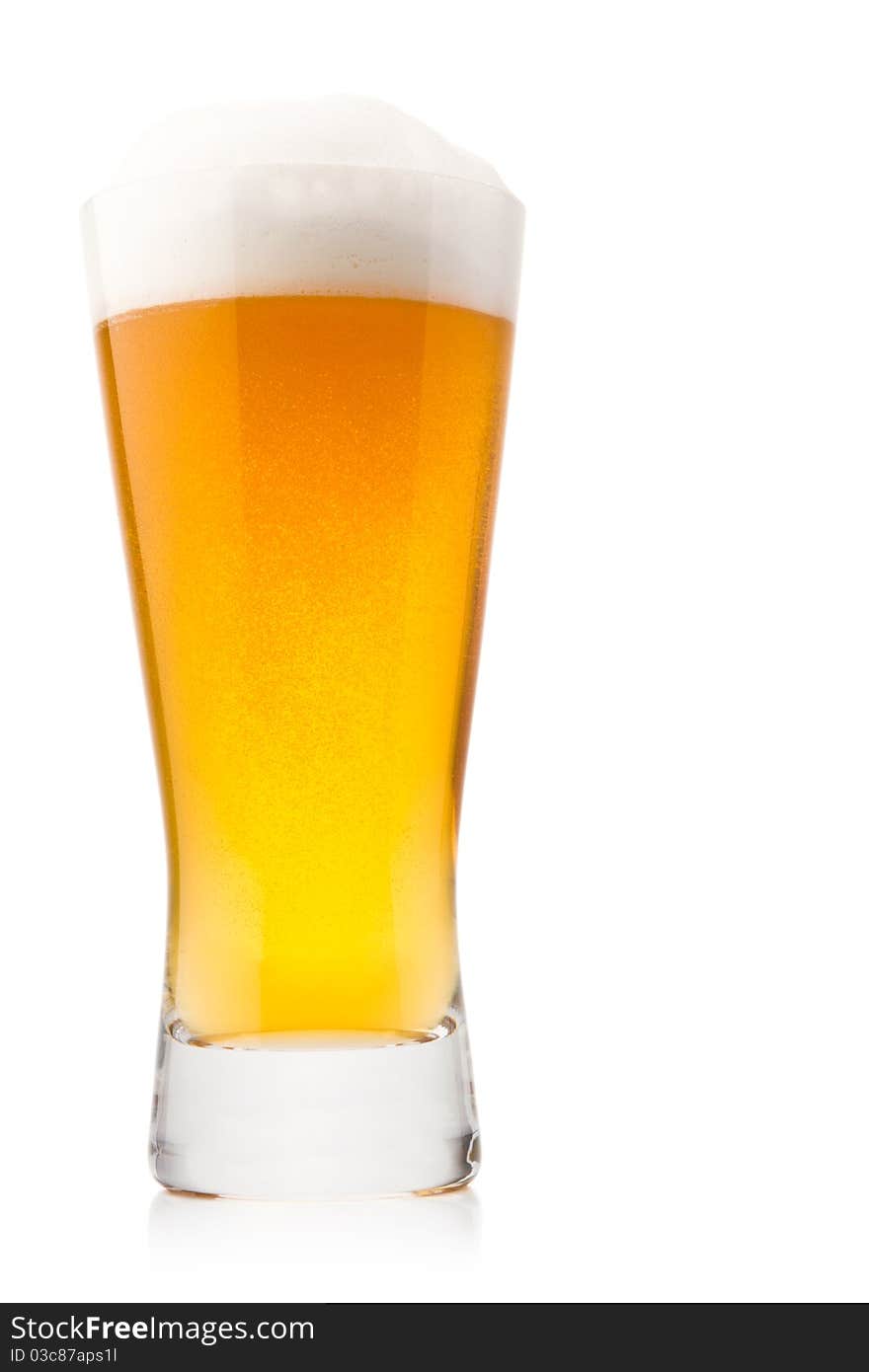 Beer into glass isolated on white. Beer into glass isolated on white