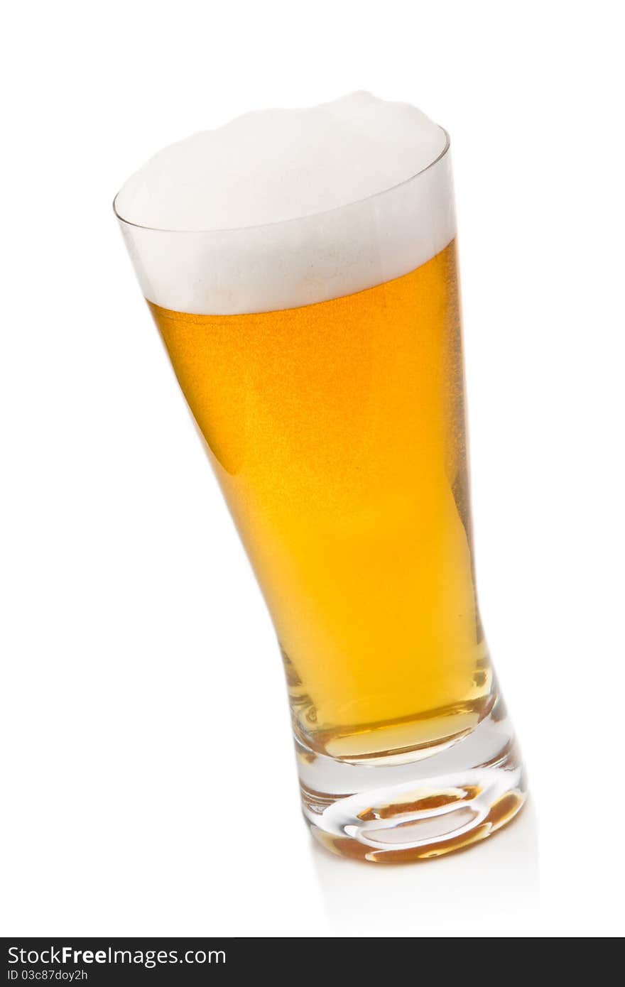 Beer into glass isolated on white. Beer into glass isolated on white