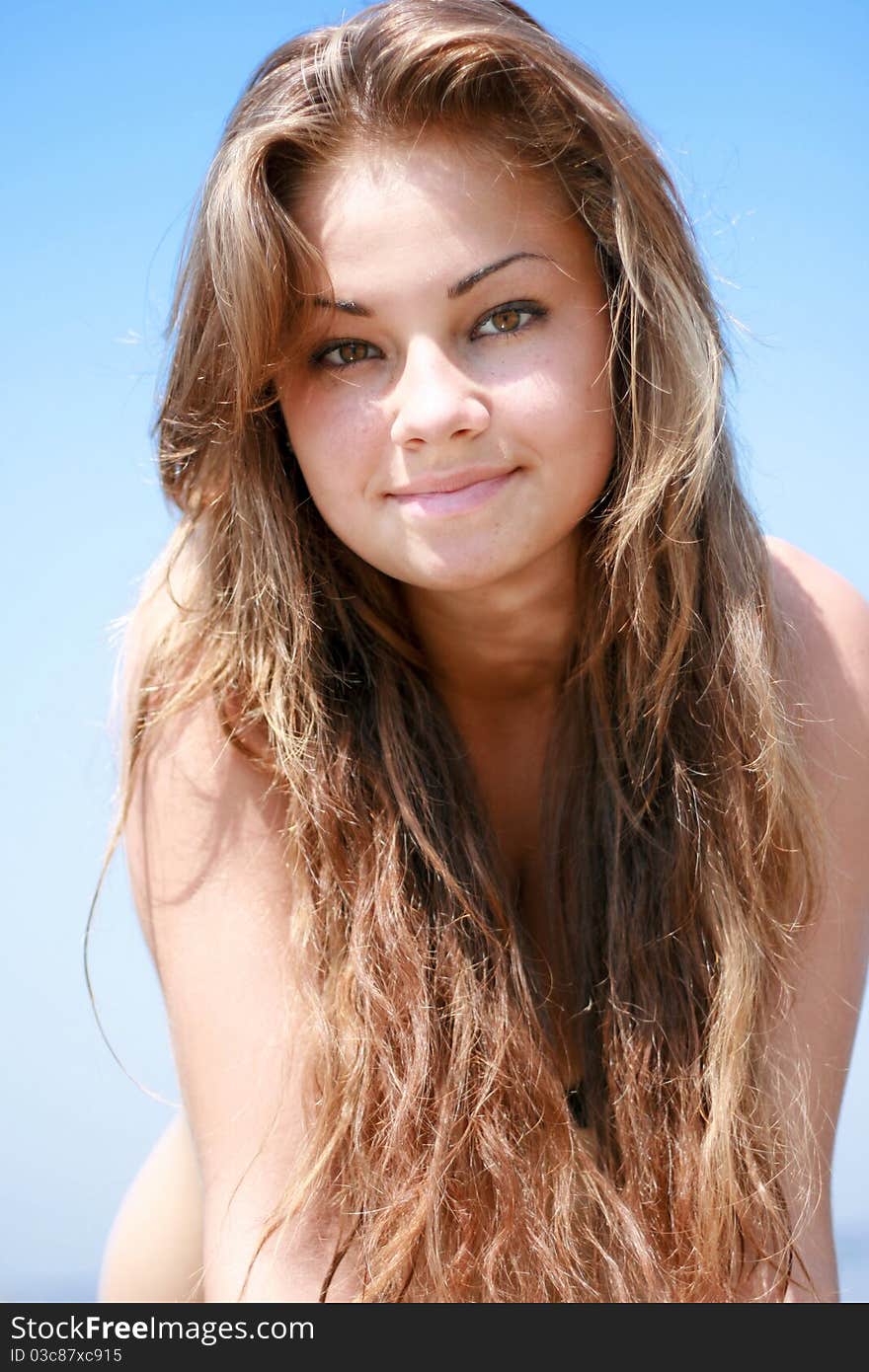 Beautiful young caucasian women portrait against blue sky