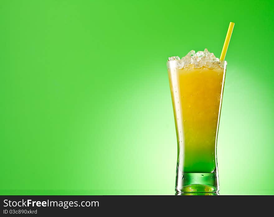 Kivi Pina colada drink cocktail glass isolated on green background. Kivi Pina colada drink cocktail glass isolated on green background