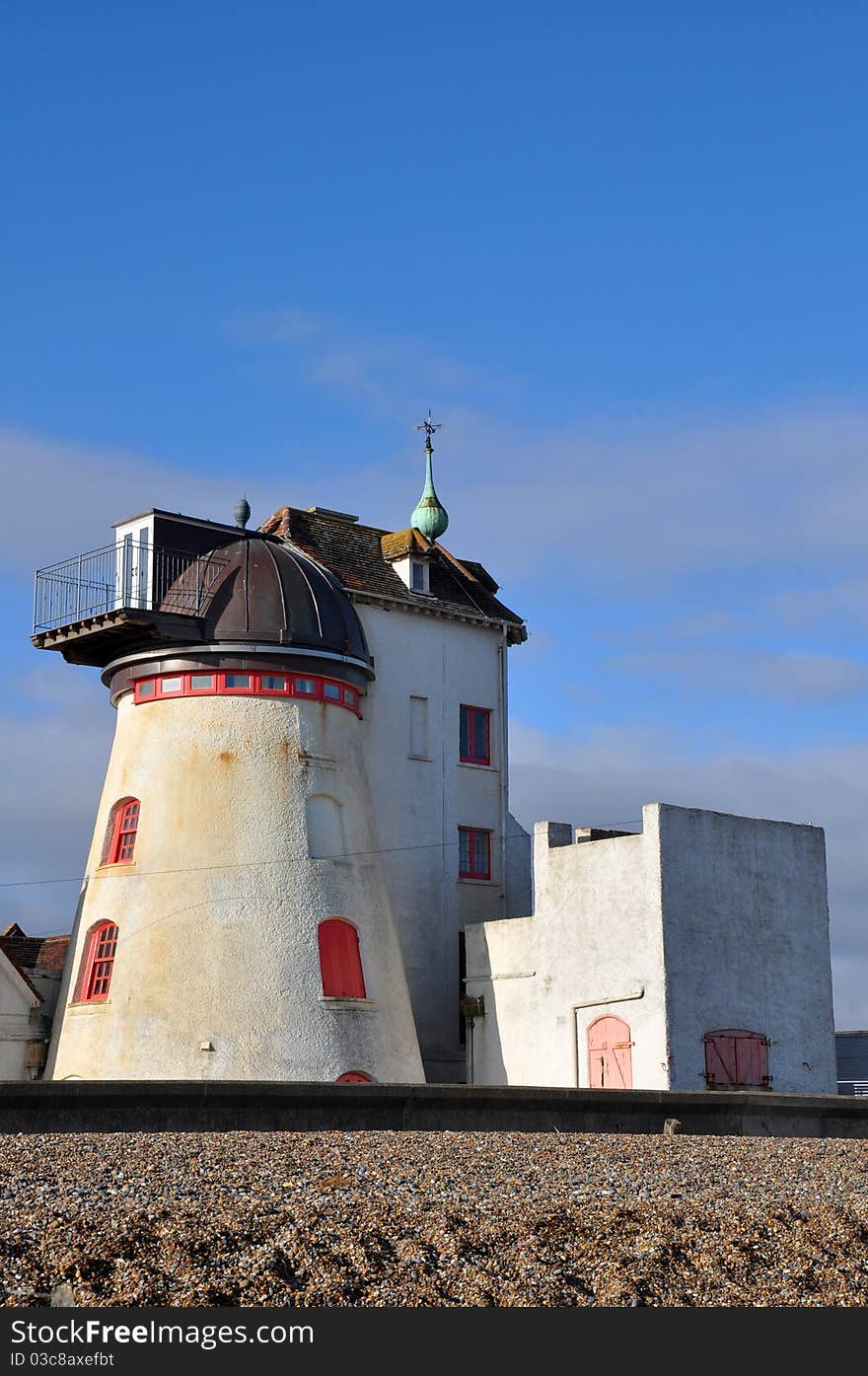 Old lighthouse and surrounding buildings by the beach. Old lighthouse and surrounding buildings by the beach