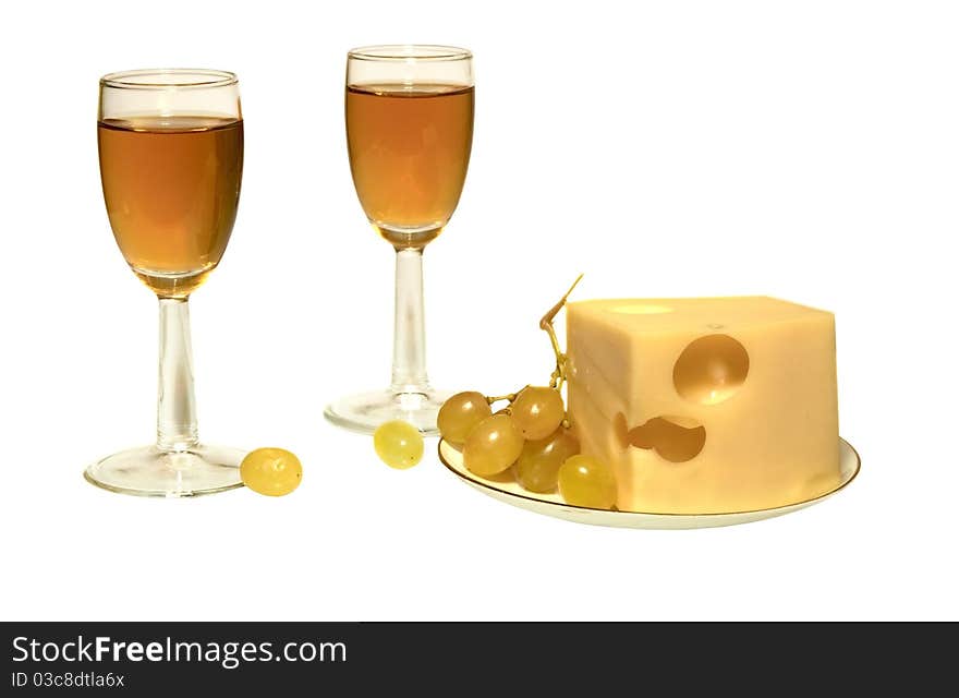 Cheese and white wine in glasses on the white isolated background