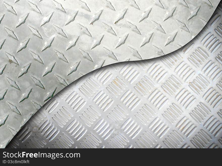 Black and white metallic mesh patterned background. Shallow depth of field. Black and white metallic mesh patterned background. Shallow depth of field