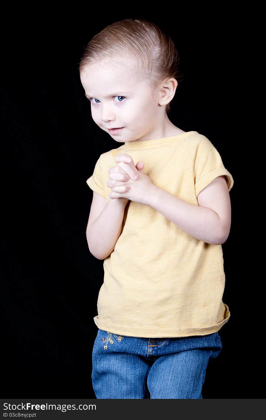 A girl with her hands crossed. She is looking at the viewer as if to say, Are you serious?