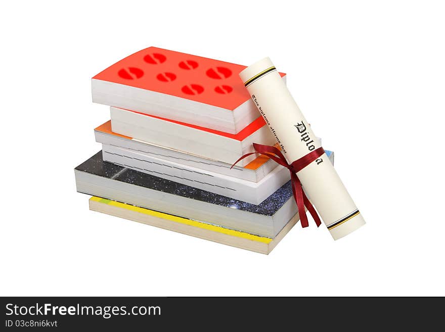 A stack of books and a diploma isiolated on a white background. Clipping path included. A stack of books and a diploma isiolated on a white background. Clipping path included.