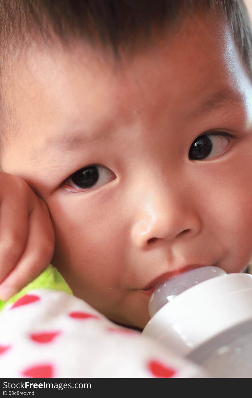 Kid with his milk bottle