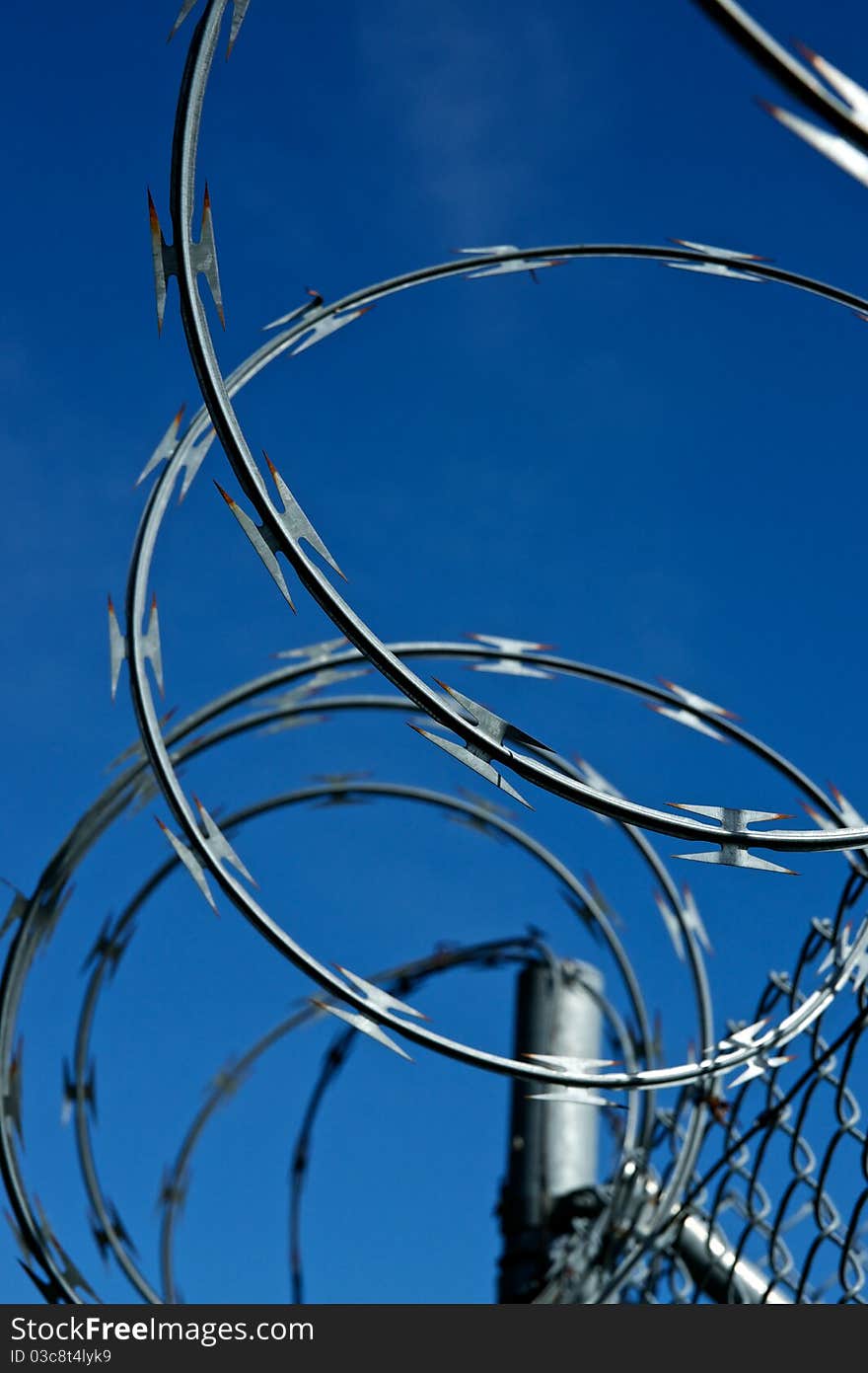 A roll of razor wire prevents. A roll of razor wire prevents