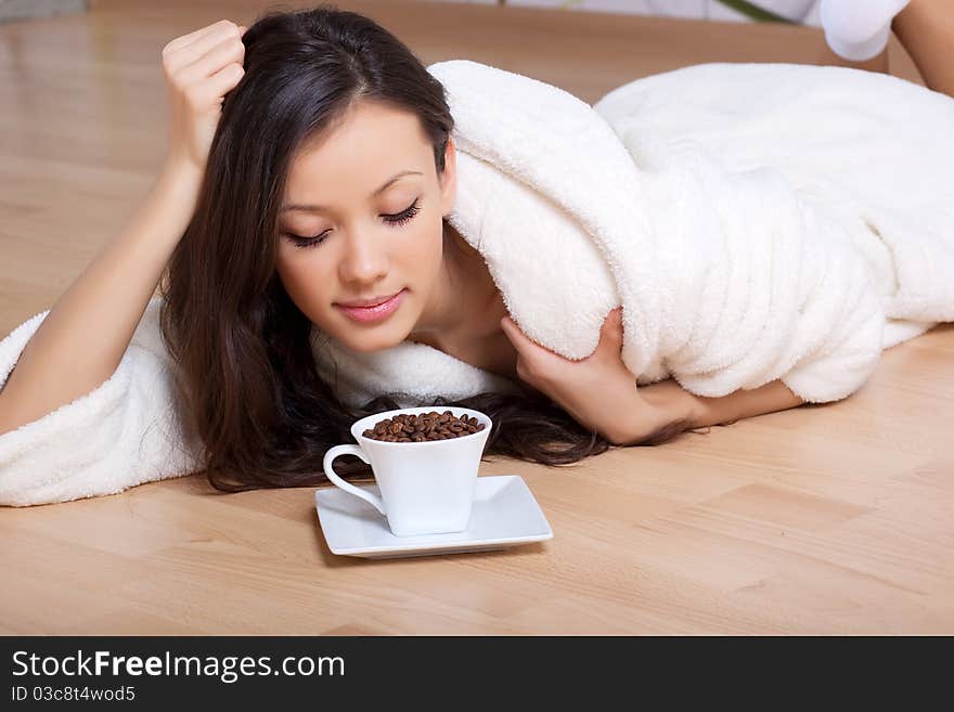 Young Woman Drinking Coffee