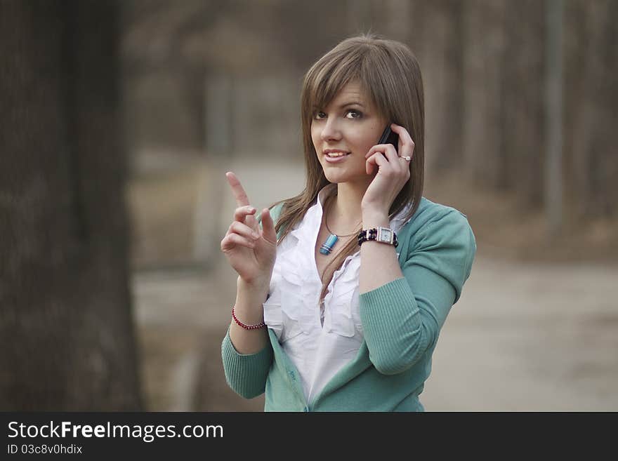 Young woman talking on phone. Young woman talking on phone