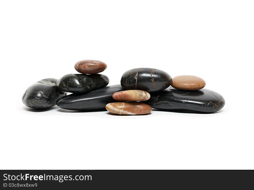 Few stones lying in a row on white background. Few stones lying in a row on white background