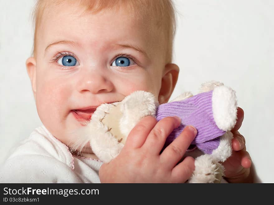 Closeup portrait of cute baby girl. Studio shot