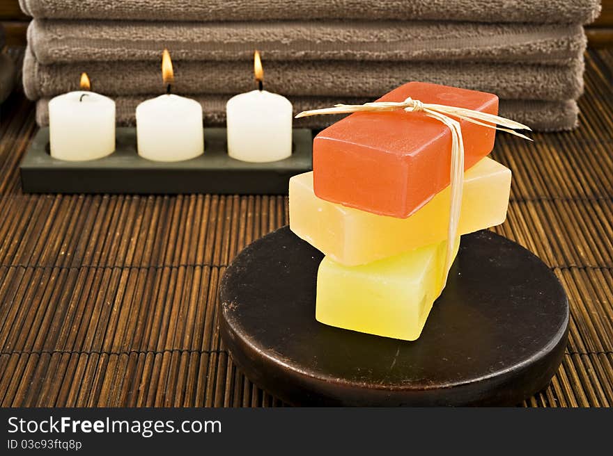 Soap candles and towels in a spa - shallow depth of field