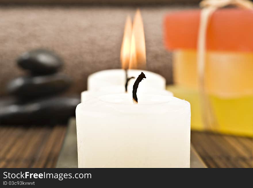 Soap candles and towels in a spa