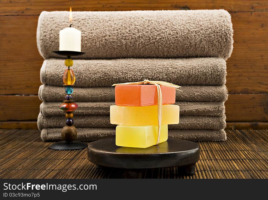 Soap candles and towels in a spa - shallow depth of field