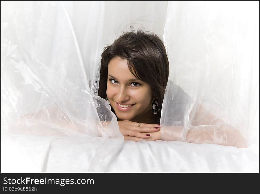 Close-up portrait of a young beautiful smiling woman with dark hair and shining Eyes. Close-up portrait of a young beautiful smiling woman with dark hair and shining Eyes.