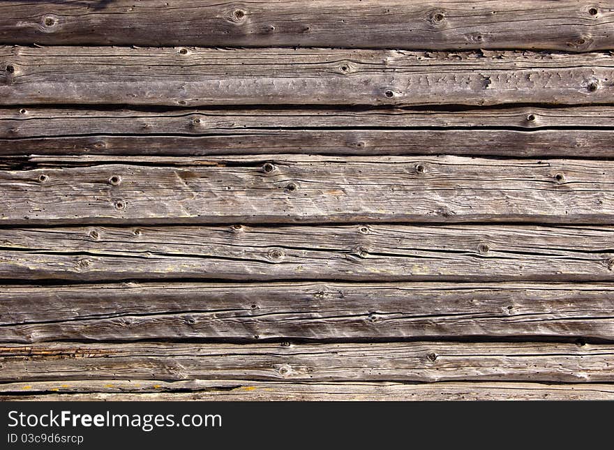 Part of a wall from logs of the old rural house. Part of a wall from logs of the old rural house