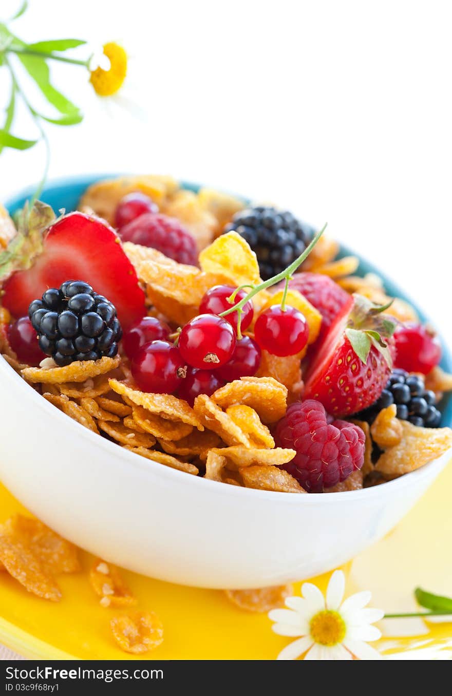 Bowl of cornflakes with milk and fruits. Bowl of cornflakes with milk and fruits