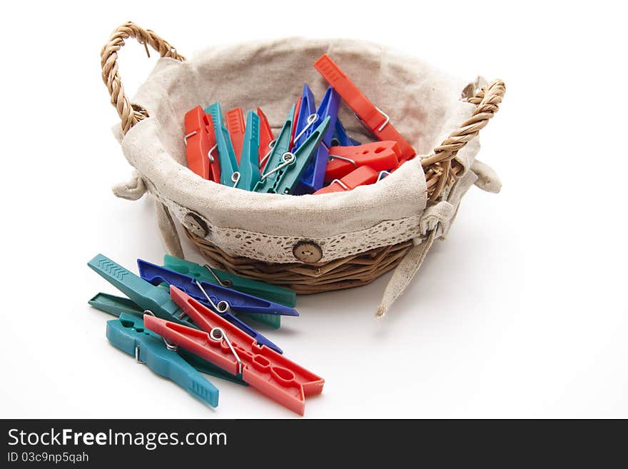 Clothespins in the woven basket with material