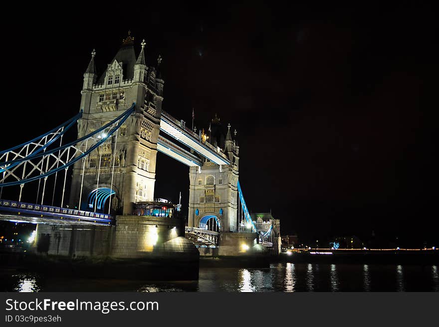 Night photo of Tower Bridge, over the river Thames in London, UK