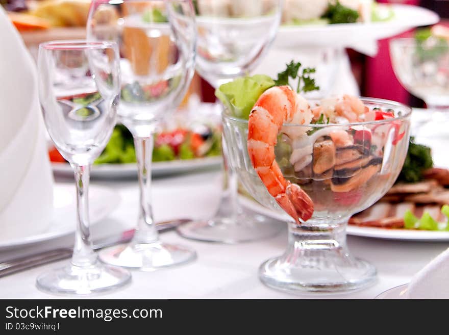 Salad with shrimps on the table