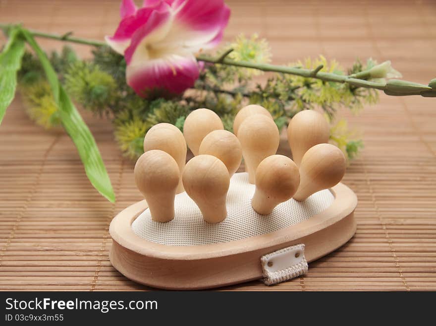 Massage brush and bunch of flowers