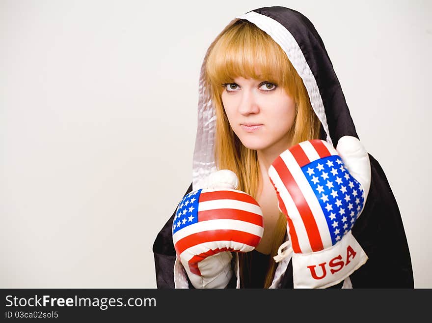 Portrait of a girl boxer on a white background