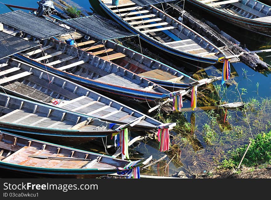 Heads of long tailed boats